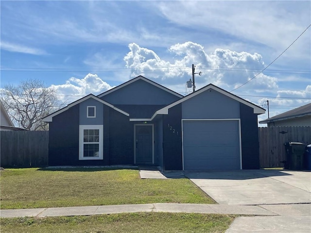 ranch-style home with driveway, an attached garage, fence, and a front yard