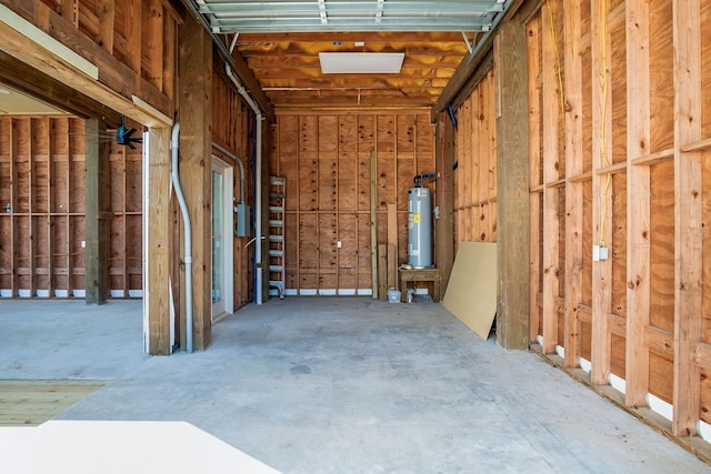 misc room with concrete flooring and water heater