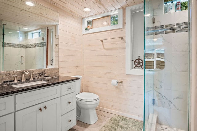 bathroom featuring toilet, wood walls, wooden ceiling, vanity, and a shower with shower door