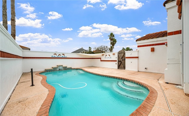 view of pool with a fenced in pool and a patio area