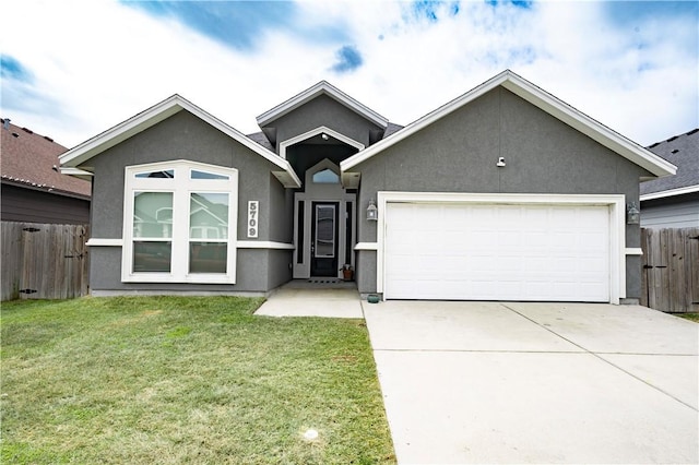 view of front of home featuring a garage and a front lawn