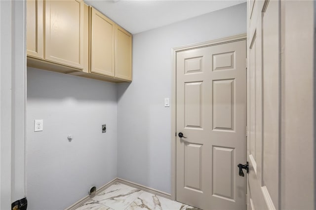 clothes washing area featuring hookup for an electric dryer and cabinets