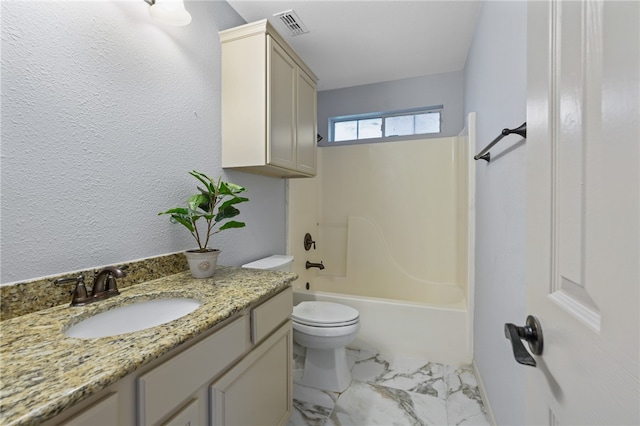 full bathroom featuring toilet, vanity, and bathing tub / shower combination