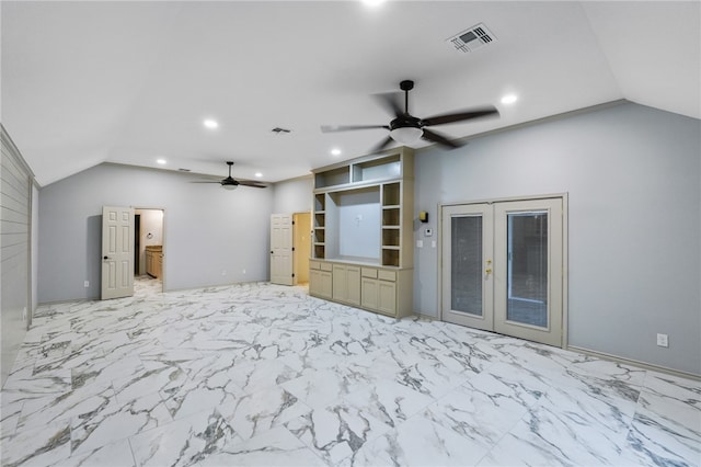 unfurnished living room featuring ceiling fan, french doors, and lofted ceiling