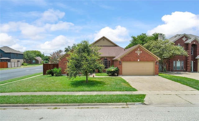 view of front of property with a garage and a front lawn