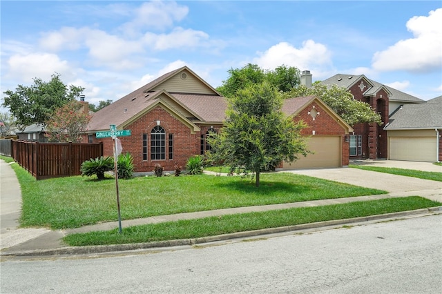 view of front of property with a garage and a front yard