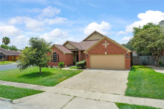 ranch-style house with a front yard, fence, brick siding, an attached garage, and driveway