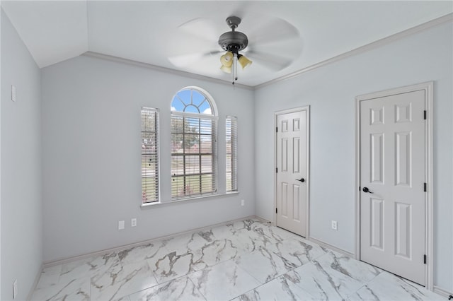 unfurnished bedroom with ornamental molding, two closets, and ceiling fan