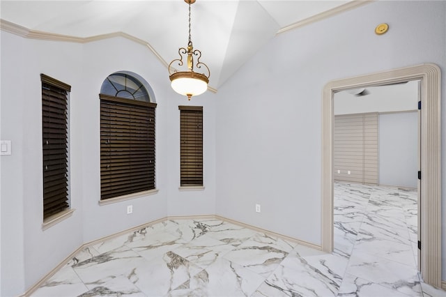 empty room featuring vaulted ceiling and crown molding