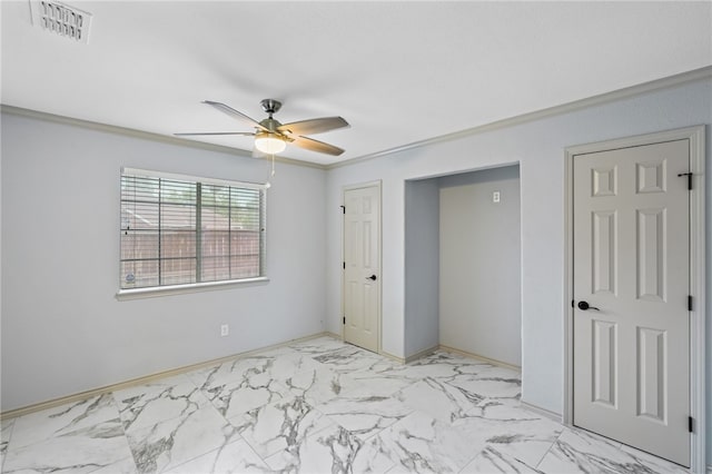 unfurnished bedroom with ceiling fan and crown molding