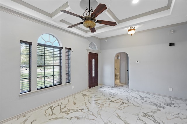 interior space featuring ceiling fan, ornamental molding, and beam ceiling