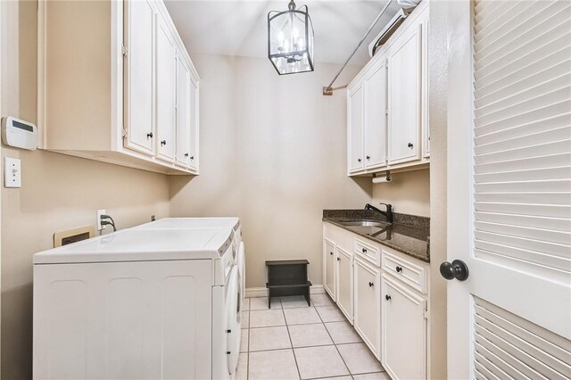 5918 Woodmere Dr, Corpus Christi, TX 78414 - laundry area featuring cabinet space, independent washer and dryer, light tile patterned flooring, and baseboards