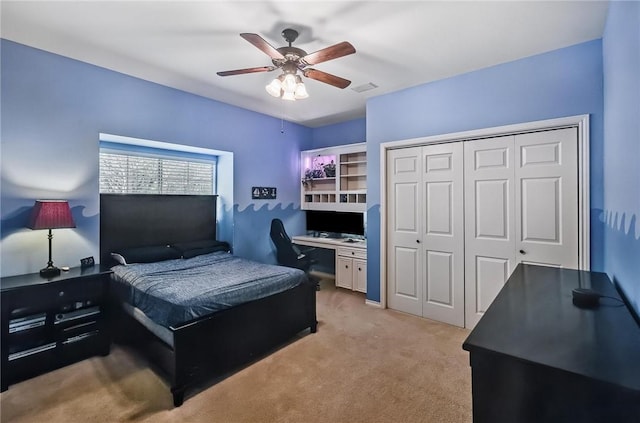 5918 Woodmere Dr, Corpus Christi, TX 78414 - bedroom featuring light carpet, a desk, a closet, and a ceiling fan