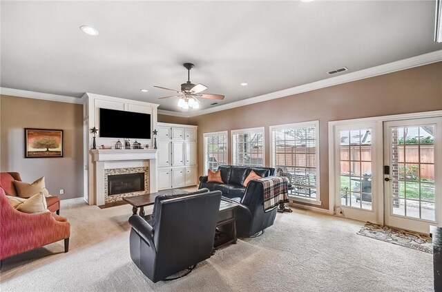5918 Woodmere Dr, Corpus Christi, TX 78414 - living area with light colored carpet, crown molding, a fireplace, baseboards, and ceiling fan
