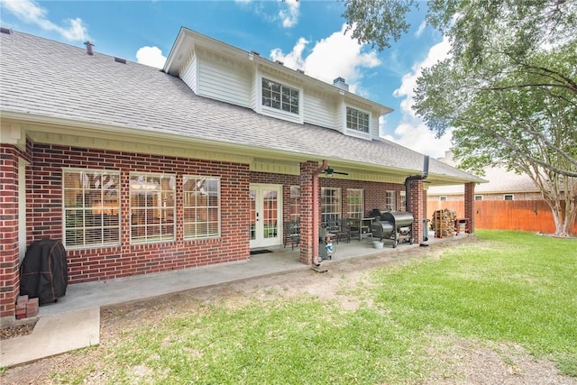 5918 Woodmere Dr, Corpus Christi, TX 78414 - back of house featuring brick siding, a shingled roof, ceiling fan, a chimney, and a patio area