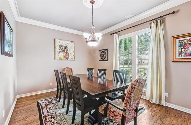 5918 Woodmere Dr, Corpus Christi, TX 78414 - dining area with light wood-type flooring, crown molding, baseboards, and a chandelier