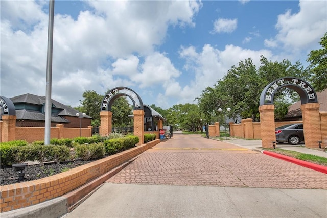 5918 Woodmere Dr, Corpus Christi, TX 78414 - view of decorative road featuring curbs and a gated entry