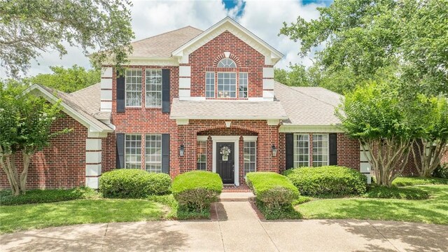 5918 Woodmere Dr, Corpus Christi, TX 78414 - colonial inspired home featuring brick siding and a shingled roof