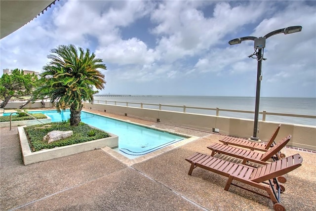 4500 Ocean Dr Unit 9A, Corpus Christi, TX 78412 - view of swimming pool featuring a water view and a patio