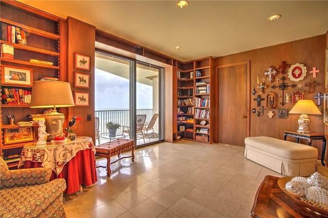 4500 Ocean Dr Unit 9A, Corpus Christi, TX 78412 - sitting room featuring wooden walls, built in features, tile patterned floors, and recessed lighting