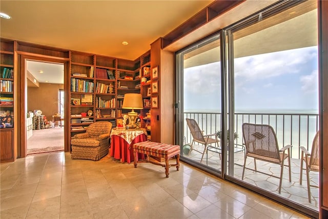 4500 Ocean Dr Unit 9A, Corpus Christi, TX 78412 - living area featuring healthy amount of natural light, built in features, a water view, and tile patterned flooring