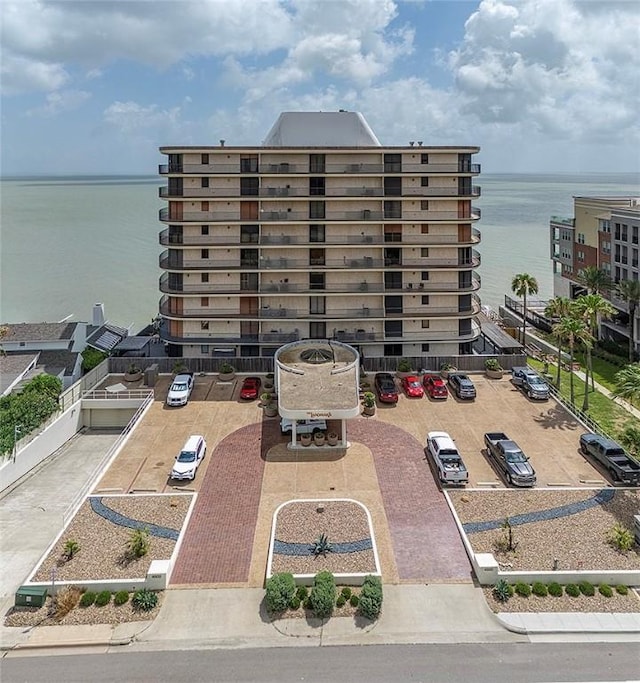 4500 Ocean Dr Unit 9A, Corpus Christi, TX 78412 - view of apartment building / complex with uncovered parking and a water view