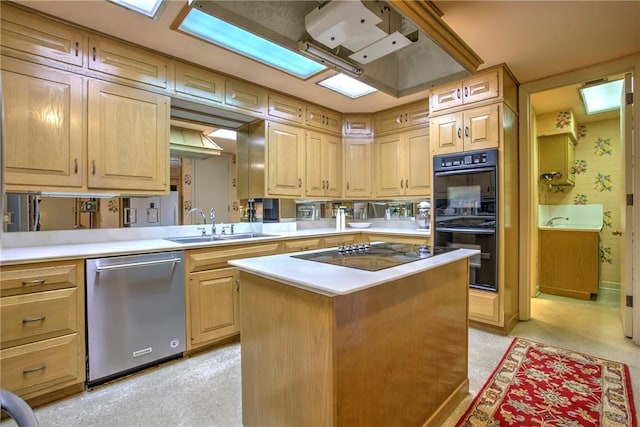 4500 Ocean Dr Unit 9A, Corpus Christi, TX 78412 - kitchen featuring black appliances, light countertops, a center island, and light brown cabinets