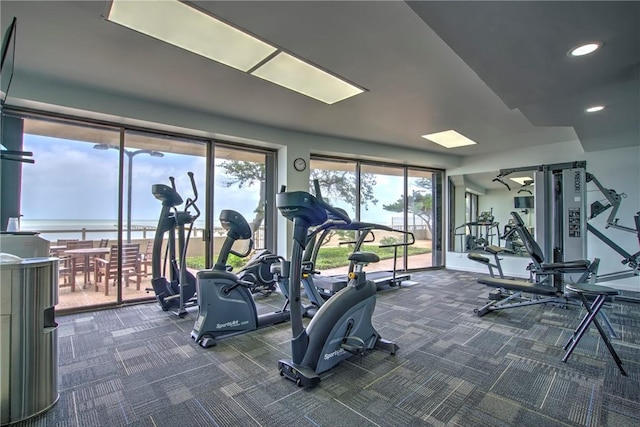 4500 Ocean Dr Unit 9A, Corpus Christi, TX 78412 - workout area with dark colored carpet, a water view, and recessed lighting