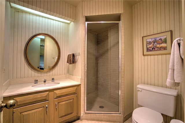 4500 Ocean Dr Unit 9A, Corpus Christi, TX 78412 - bathroom featuring wallpapered walls, vanity, a stall shower, and tile patterned floors