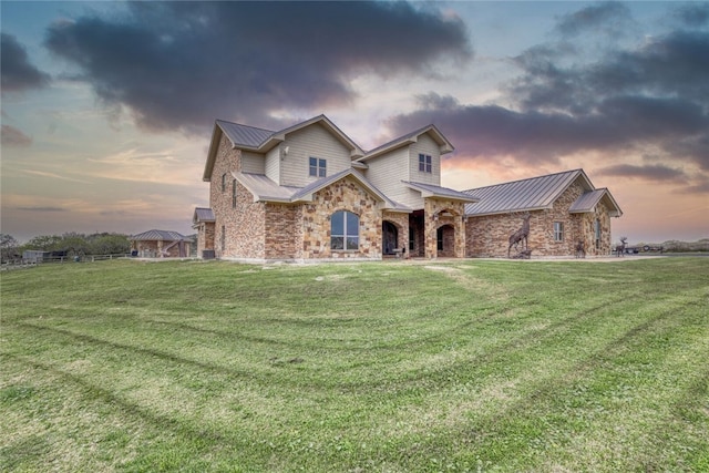 view of front of house with a lawn