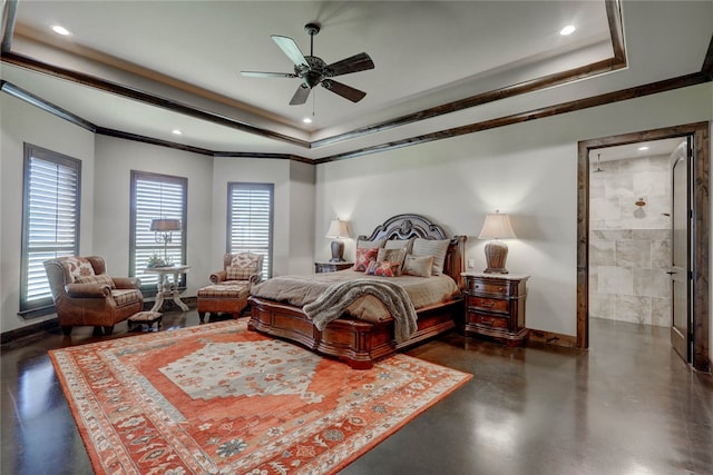 bedroom featuring ceiling fan, a raised ceiling, ornamental molding, and connected bathroom