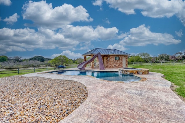 view of swimming pool with an in ground hot tub and a water slide