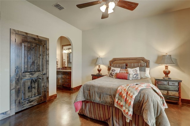 bedroom featuring ceiling fan and connected bathroom