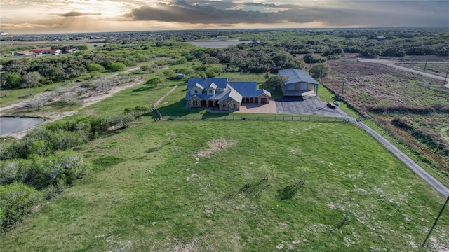 aerial view at dusk featuring a rural view