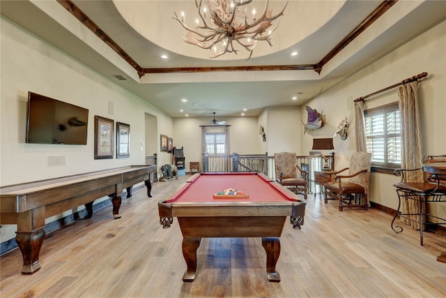 game room with a raised ceiling, a healthy amount of sunlight, and billiards