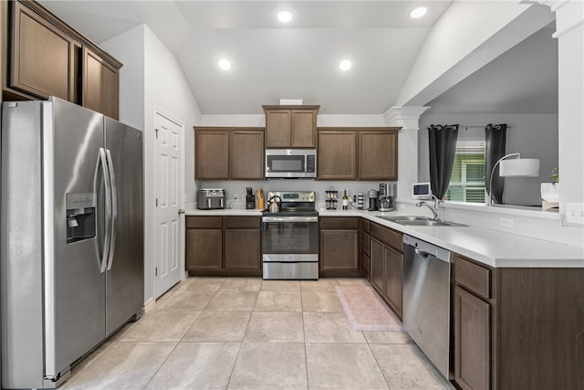 6734 Mikayla St, Corpus Christi, TX 78413 - kitchen with appliances with stainless steel finishes, vaulted ceiling, light countertops, light tile patterned flooring, and recessed lighting