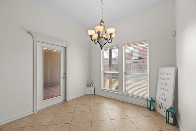 empty room featuring light tile patterned floors, a chandelier, and ornamental molding