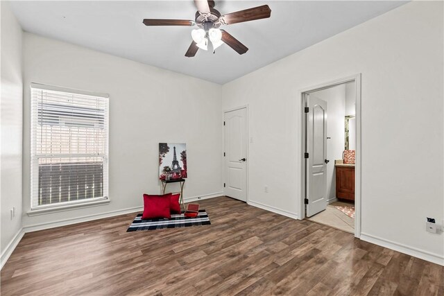 spacious closet with dark hardwood / wood-style floors