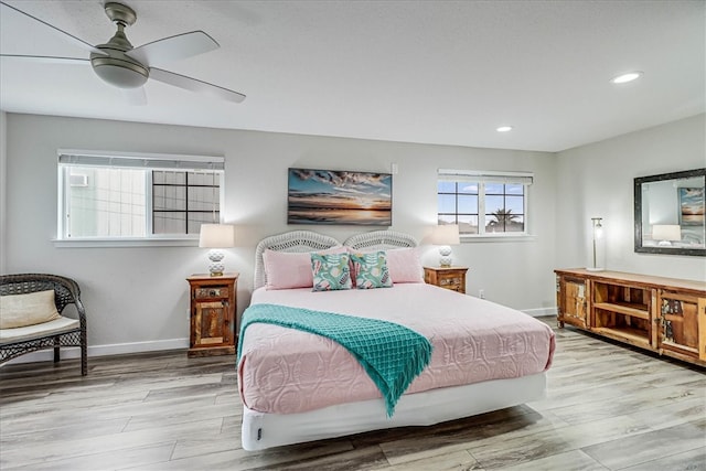 bedroom featuring light hardwood / wood-style floors and ceiling fan