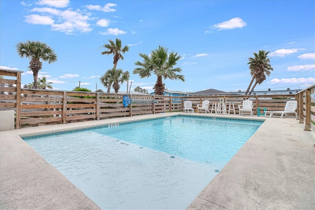 view of swimming pool with a patio area