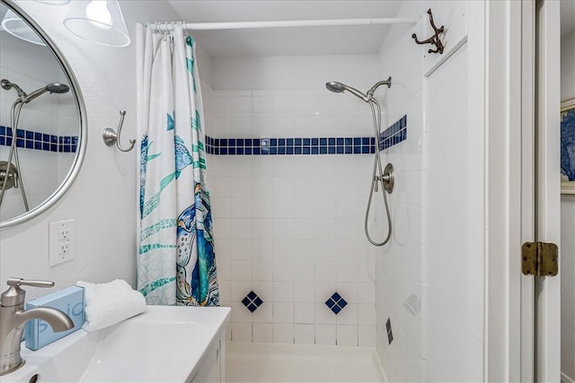 bathroom with sink and curtained shower