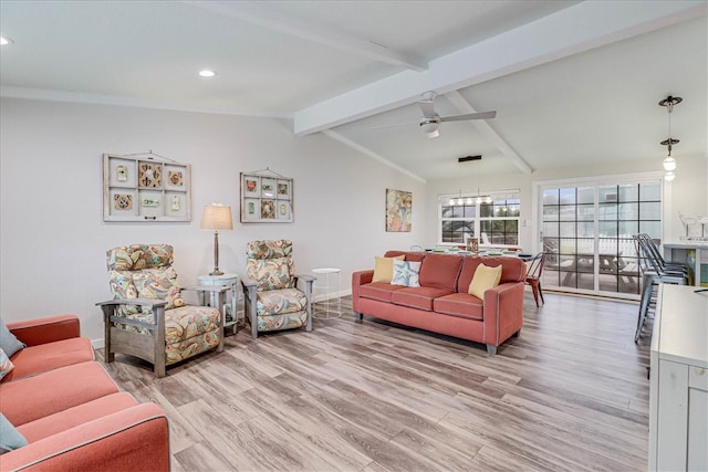 living room featuring light hardwood / wood-style flooring, vaulted ceiling with beams, and ceiling fan