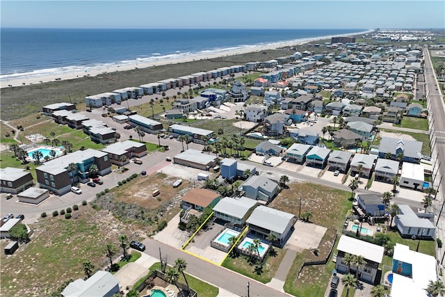 bird's eye view featuring a beach view and a water view