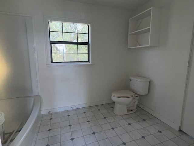 bathroom with a bath and toilet