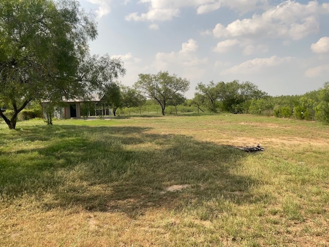 view of yard with a rural view