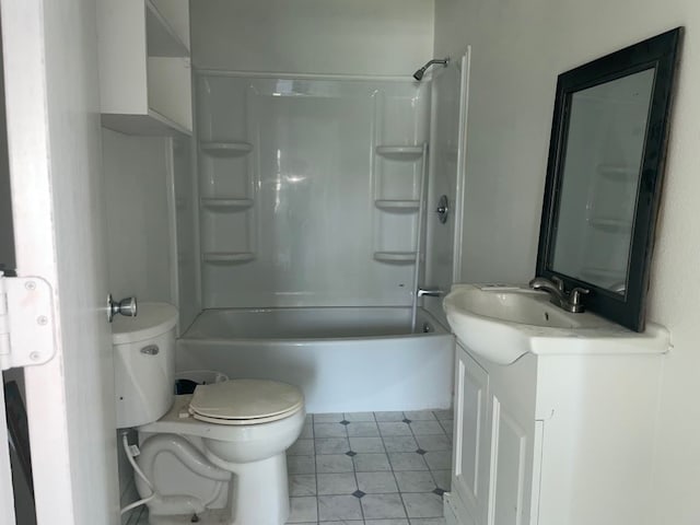 full bathroom with tub / shower combination, tile patterned floors, vanity, and toilet