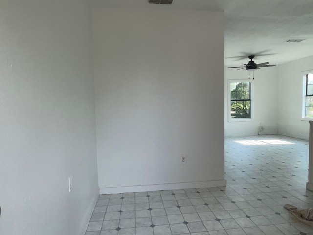 unfurnished room with ceiling fan