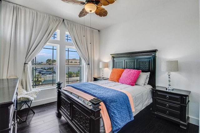 602 Banyan Beach Dr, Port Aransas, TX 78373 - bedroom featuring dark wood-type flooring and a ceiling fan