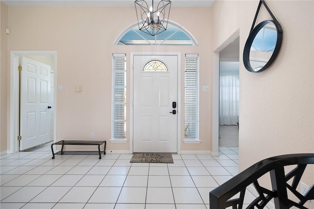 1025 Pompano Dr, Aransas Pass, TX 78336 - foyer featuring light tile patterned floors and a chandelier