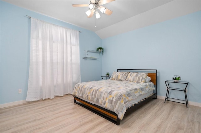 1025 Pompano Dr, Aransas Pass, TX 78336 - bedroom featuring wood finished floors, lofted ceiling, and a ceiling fan
